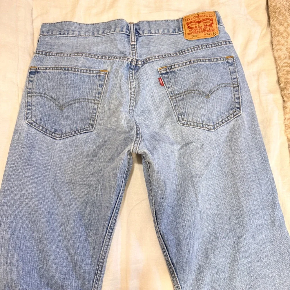 Levis 569 Loose Straight Leg Jeans Mens 34x30 Light Wash Blue Denim 00569-0110